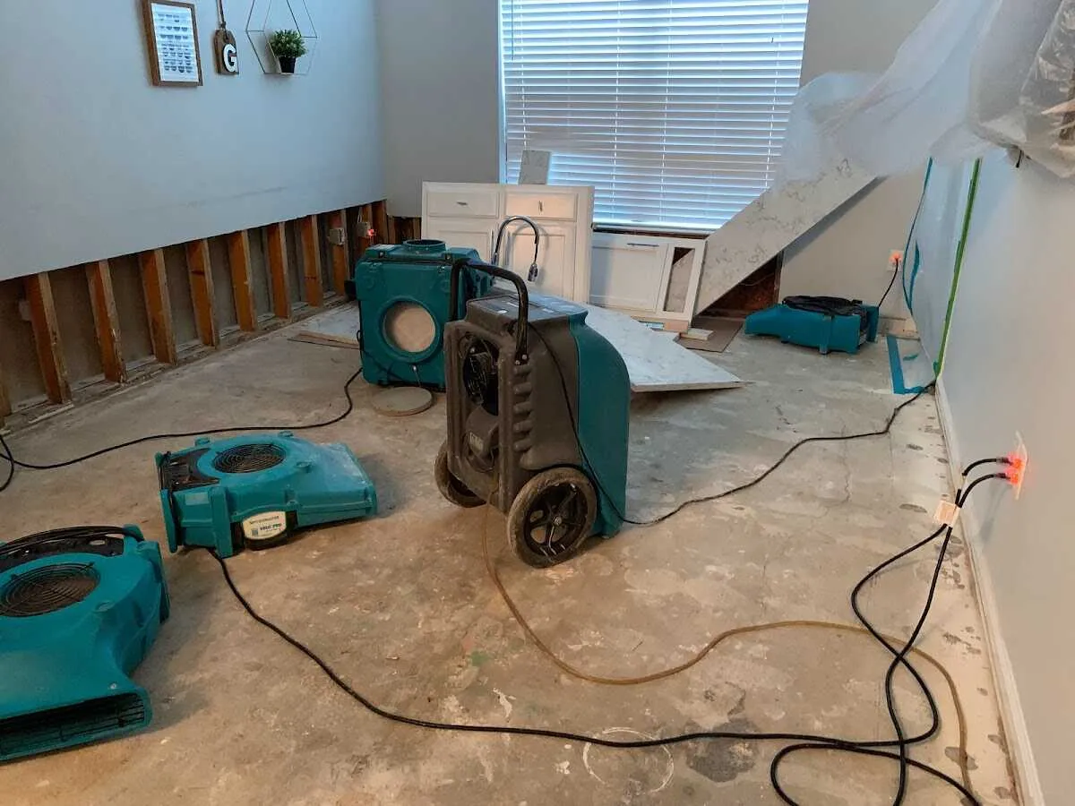 Dehumidifier in flood-cut room for Water Damage Restoration in Manor